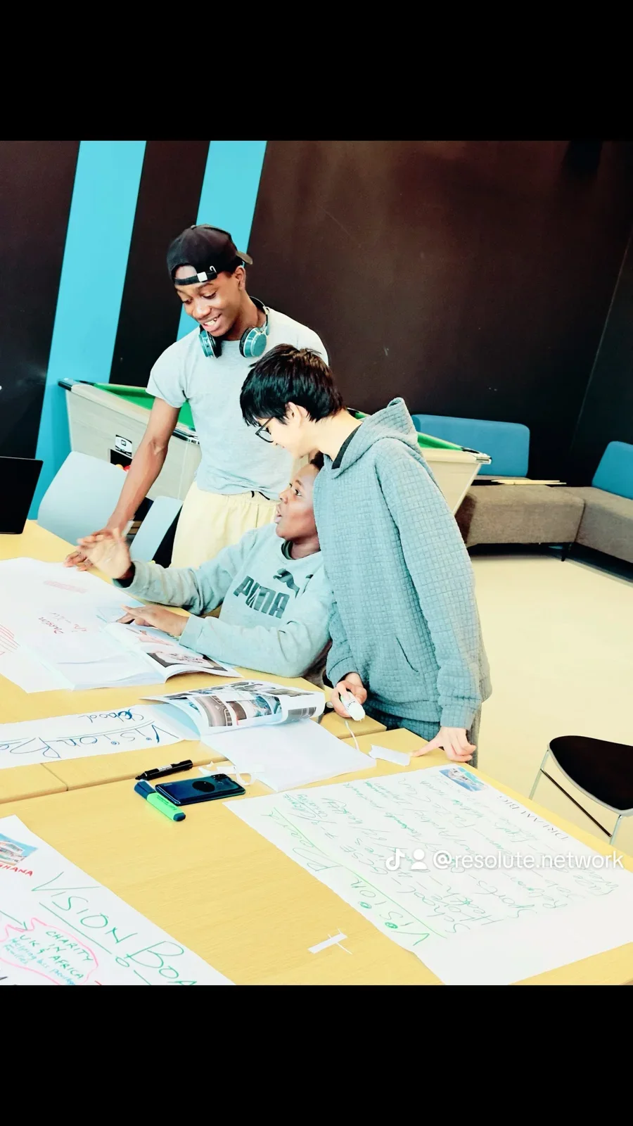 Young people exploring their creativity together at an art workshop