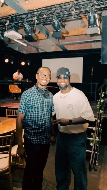 Two attendees together at a community event